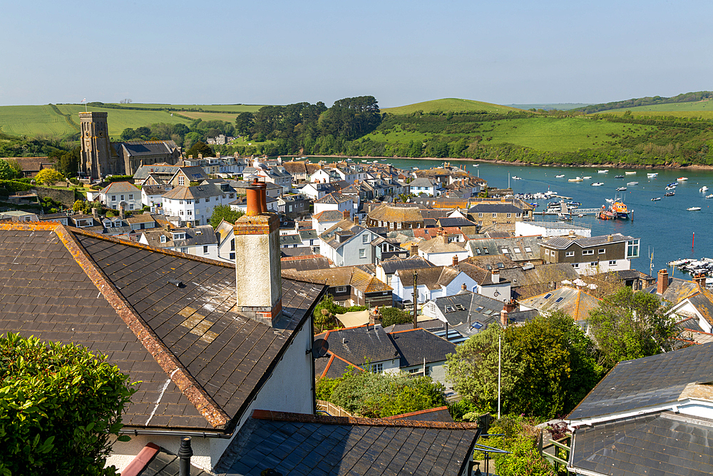 View over rooftops to boats in harbour at Salcombe, south Devon, England, UK