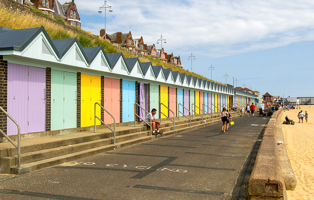 Colourful beach huts and promenade footpath, South Beach, Lowestoft, Suffolk, England, UK