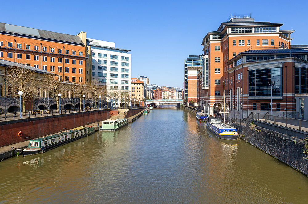 Narrow boats River Avon Floating Harbour, modern buildings, Temple Quarter regeneration, Bristol, England, UK view to Temple Bridge