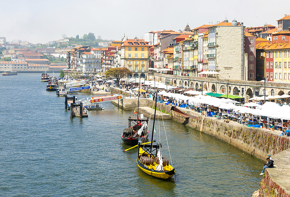 Market stalls selling tourist souvenirs, River Douro waterfront, Ribeira district, city of Porto, Portugal, Europe