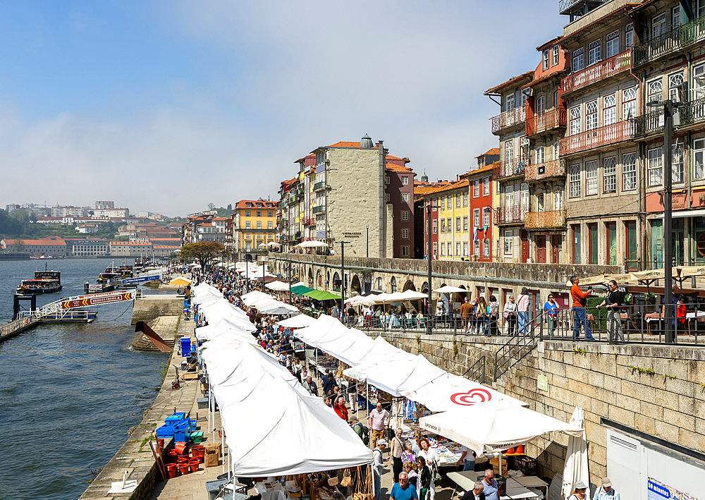 Market stalls selling tourist souvenirs, River Douro waterfront, Ribeira district, city of Porto, Portugal, Europe