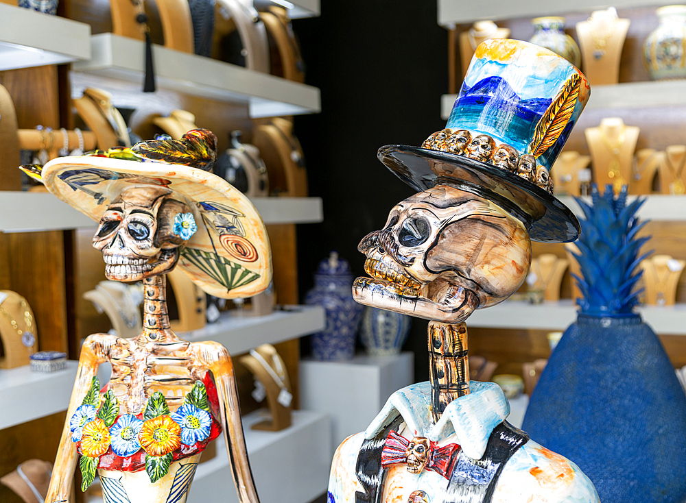 Ceramic skull and bones death artwork pieces inside gallery shop, Calzado Calle de los Frailes, Valladolid, Yucatan, Mexico, North America