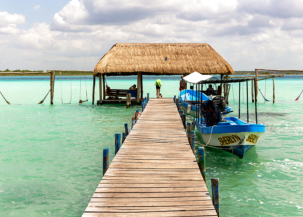 Cabana thatched cabin on wooden jetty pier, Lake Bacalar, Bacalar, Quintana Roo, Yucatan Peninsula, Mexico, North America