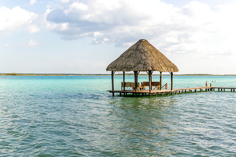 Cabana thatched cabin on wooden jetty Lake Bacalar, Bacalar, Quintana Roo, Yucatan Peninsula, Mexico, North America