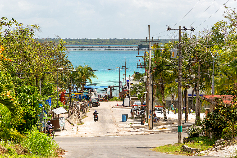 Untidy view down to water, with wires and telegraph poles, Lake Bacalar, Bacalar, Quintana Roo, Yucatan Peninsula, Mexico, North America