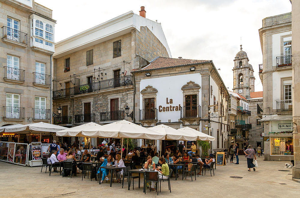 People and street cafes bars, Plaza de la Constitucion square, old town city centre of Vigo, Galicia, Spain, Europe