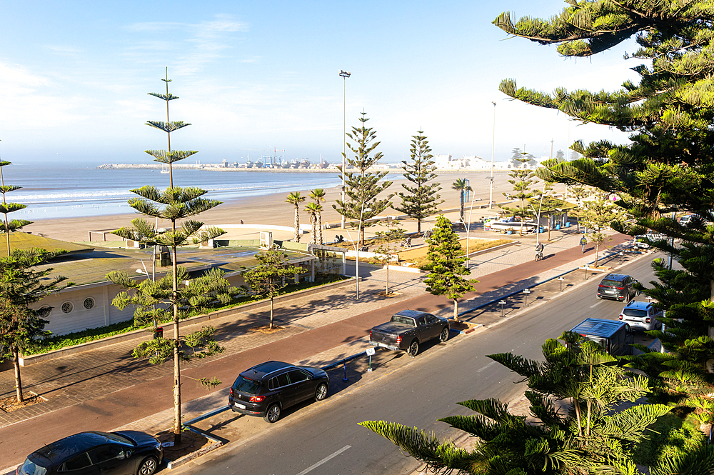 Raised view over sandy beach towards fishing port, Essaouira, Morocco, North Africa, Africa