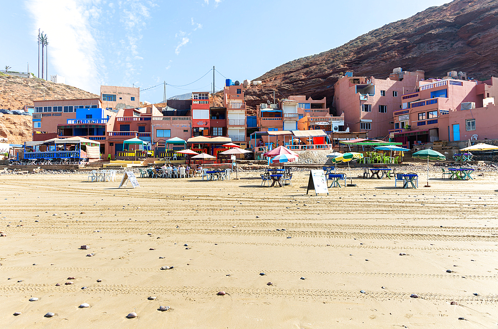 Sandy beach and buildings, Legzira, southern Morocco, North Africa, Africa