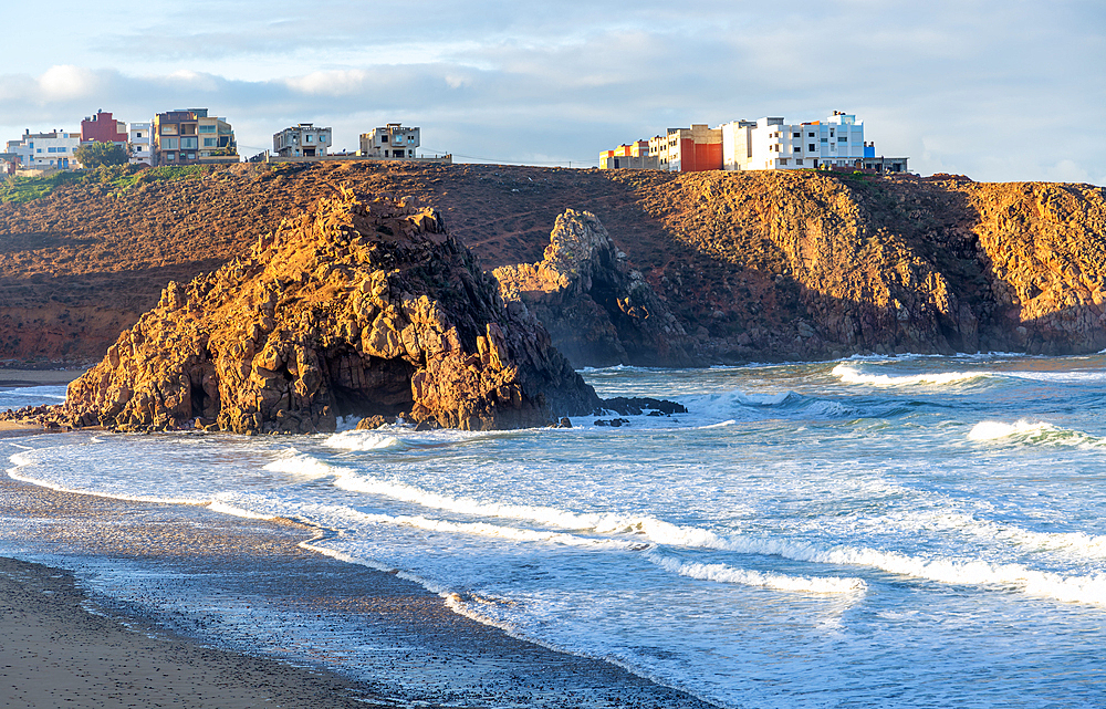 Beach with rocky outcrop on coastline in bay, Plage Sidi Mohammed Ben Abdellah, Mirleft, Morocco, North Africa, Africa