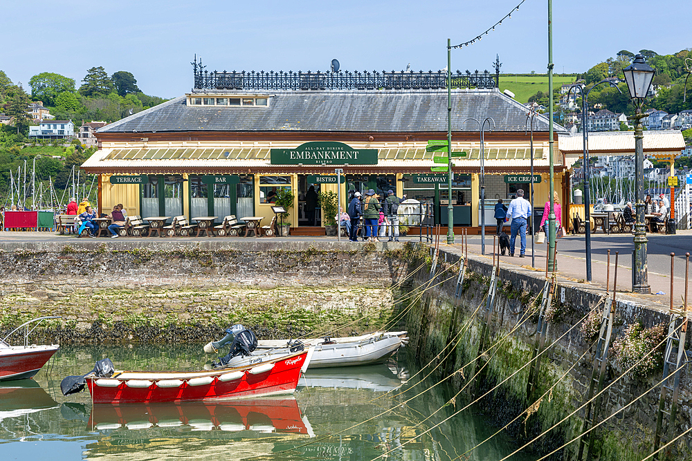 Boats moored in inner harbour view to Embankment cafe bistro, Dartmouth, Devon, England, United Kingdom, Europe