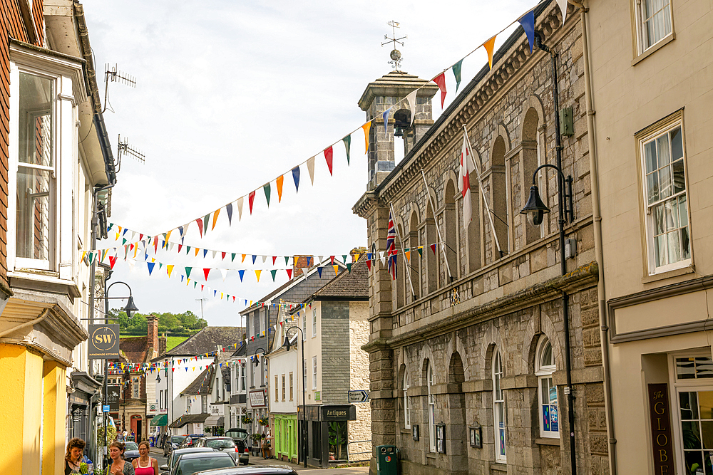 Bunting across street between Town Hall and shops, Ashburton, south Devon, England, United Kingdom, Europe