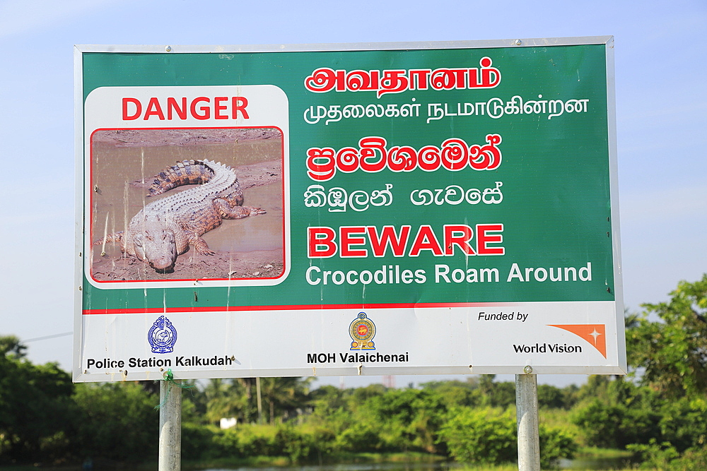 Danger sign warning of crocodiles, Pasikudah Bay, Eastern Province, Sri Lanka, Asia