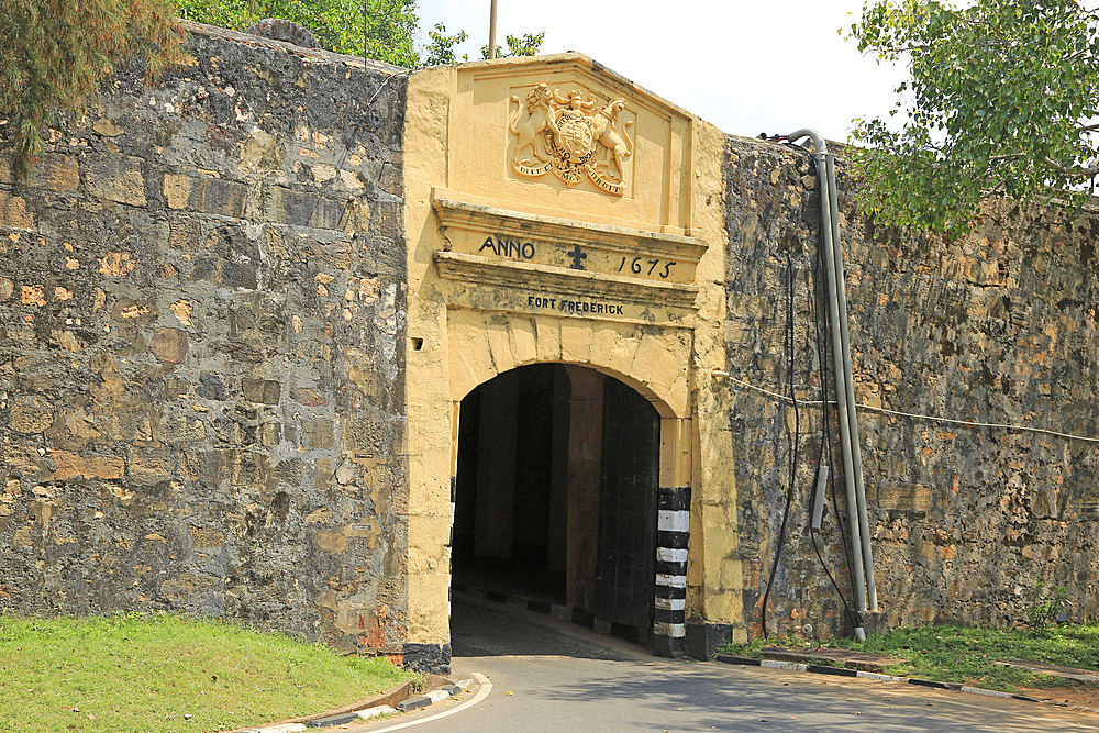 Gateway, Fort Frederick, 1675, with Dieu et Mon Droit on coat of arms over arch, Trincomalee, Eastern province, Sri Lanka, Asia