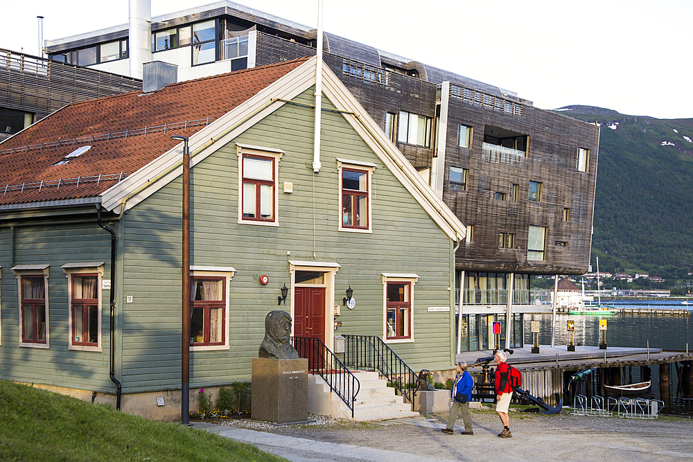 Tourists viewing Roald Amundsen bust statue at the Polar Museum, Tromso, Norway, Scandinavia, Europe