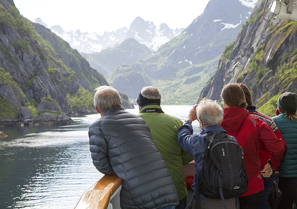 Tourists sightseeing from Hurtugruten ship, Trollfjorden, Lofoten Islands, Nordland, northern, Norway, Scandinavia, Europe