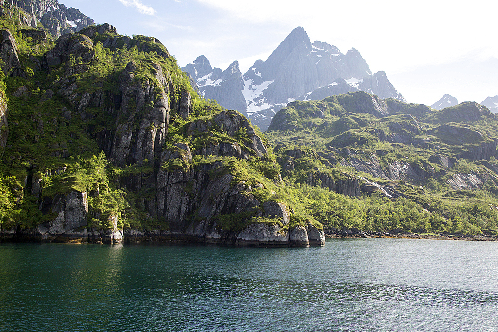 Steep sided glacial trough fiord and jagged mountain peaks, Trollfjorden, Lofoten Islands, Nordland, northern, Norway, Scandinavia, Europe