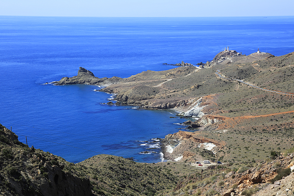 Coastal landscape, Cabo de Gata natural park, looking west to the lighthouse, Almeria, Andalusia, Spain, Europe