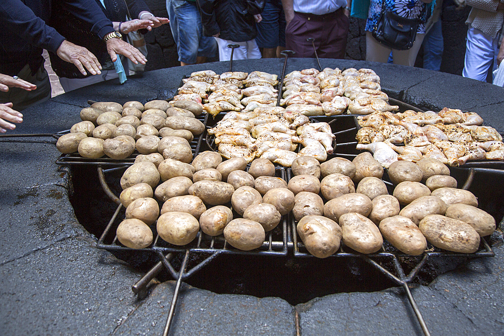 Food being cooked on volcanic grill at visitor centre, Parque Nacional de Timanfaya, national park, Lanzarote, Canary Islands, Atlantic, Europe