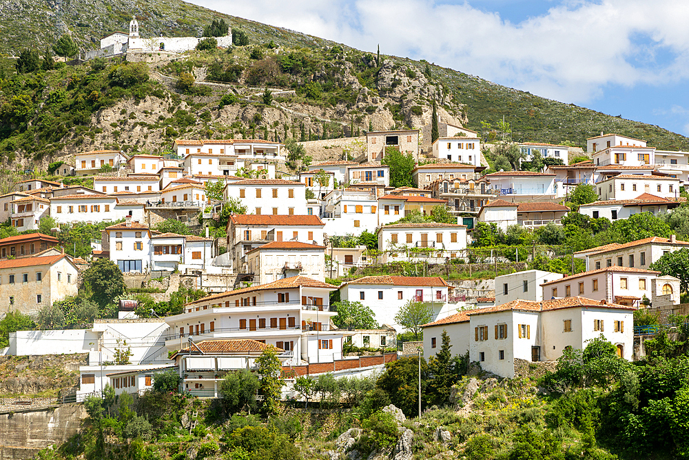 View of whitewashed buildings on mountainside, village of Dhermi, Albania, Europe