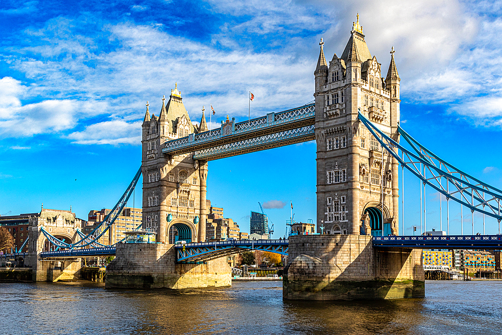 Sunny day view of the iconic Tower Bridge over the River Thames,with blue skies and fluffy clouds, London, England, United Kingdom, Europe