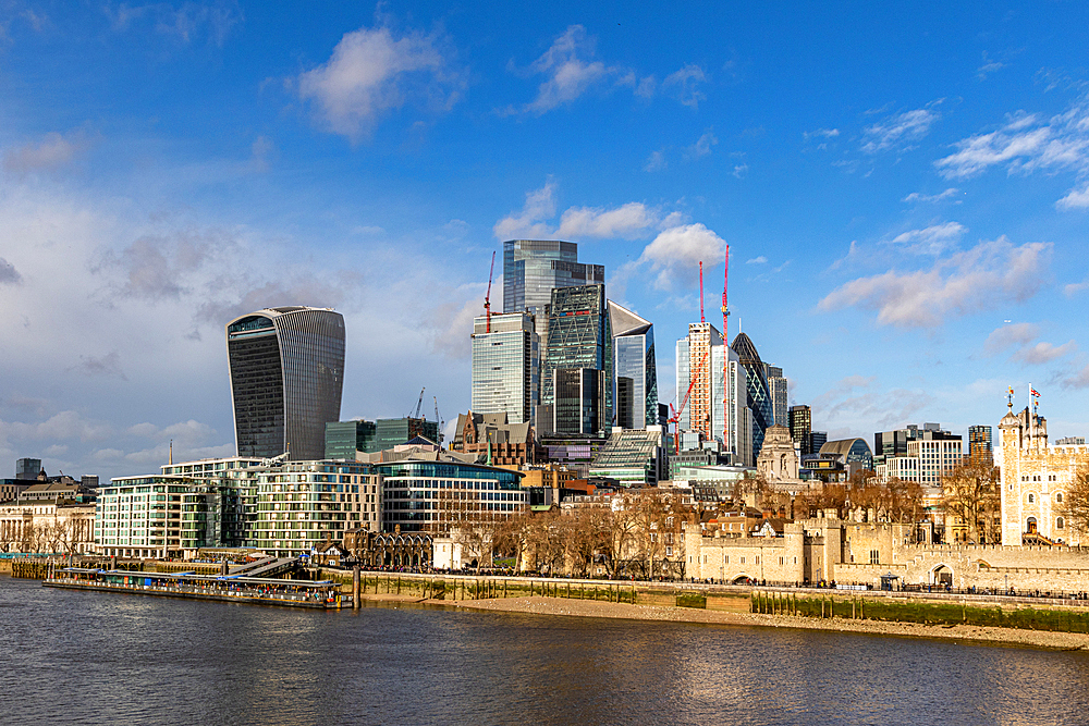 London skyline with modern buildings and blue sky, viewed from across the River Thames, London, England, United Kingdom, Europe