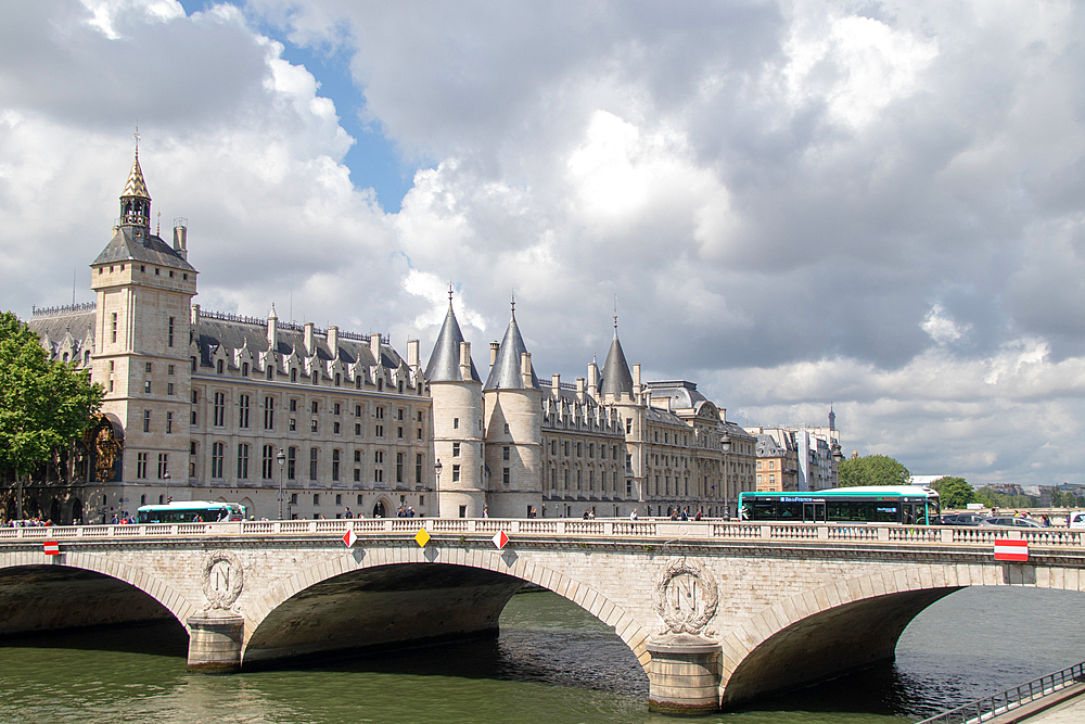 Scenic view of the Conciergerie and Pont au Change bridge over the Seine River, Paris, France, Europe