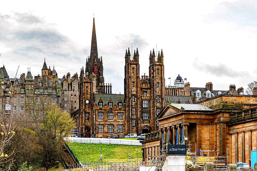 Historic architecture in Edinburgh with the Hub and spires against a cloudy sky, showcasing Scotland's capital city's charm, Edinburgh, Scotland, United Kingdom, Europe