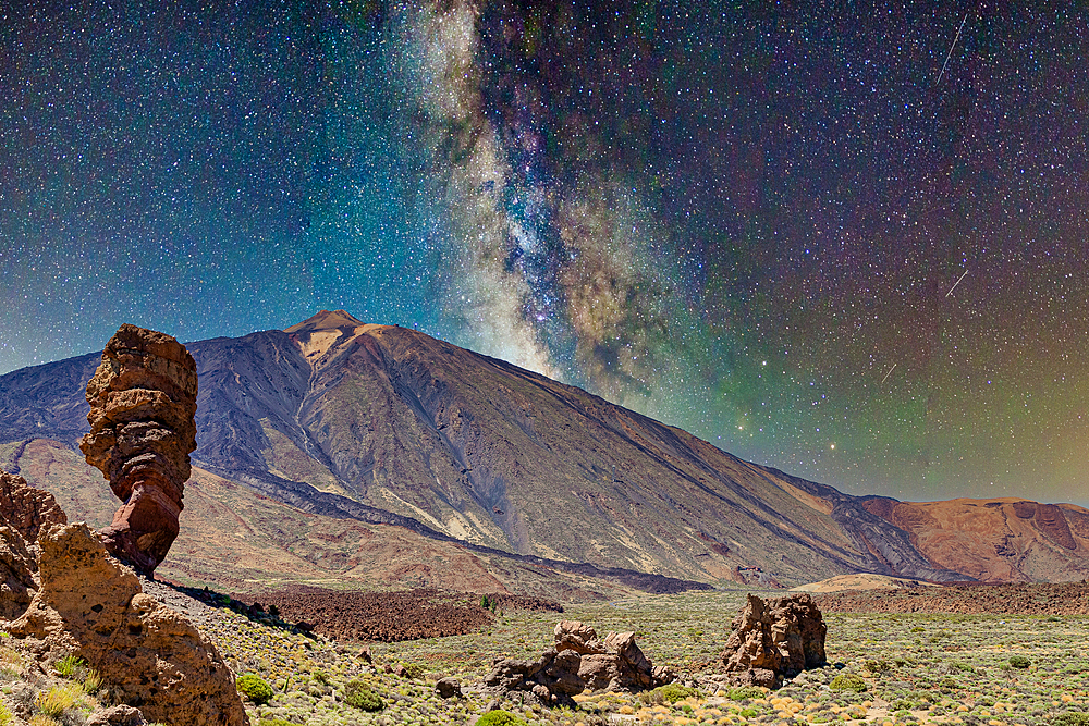 Starry night sky over majestic mountain landscape with Milky Way visible and rocky terrain in the foreground, Teide National Park, UNESCO World Heritage Site, Tenerife, Canary Islands, Spain, Atlantic, Europe