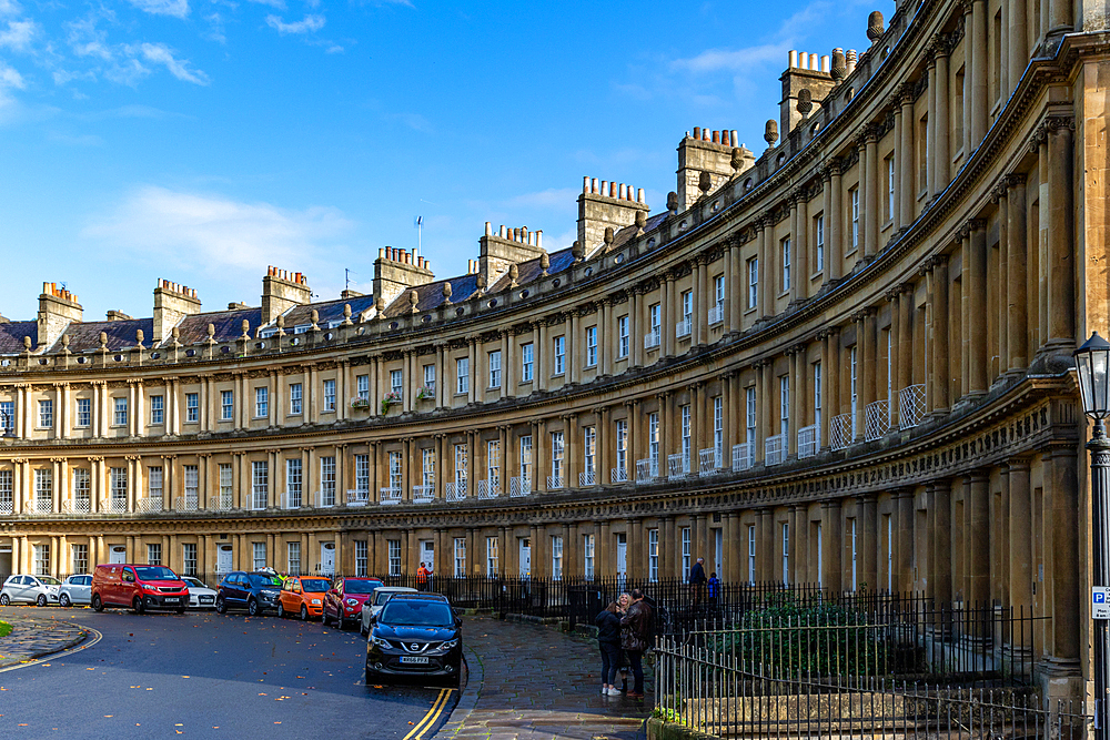 Historic Georgian crescent architecture with parked cars on a sunny day, The Circus, Bath, England in Bath, Somerset, England, United Kingdom, Europe