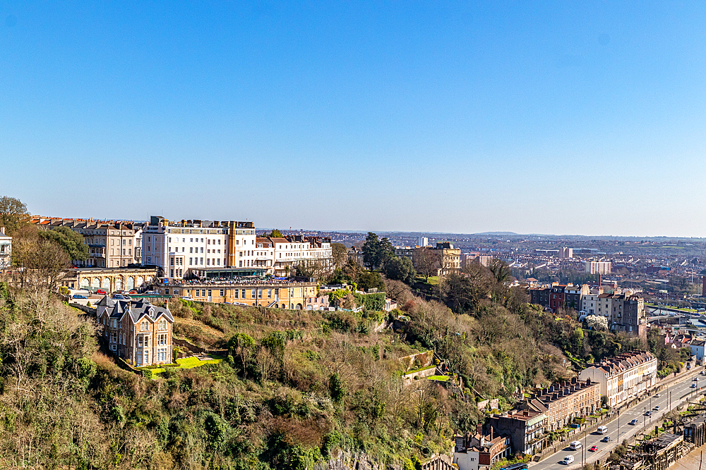 Breathtaking cityscape with historic buildings on a sunny day, clear blue sky, and lush greenery, Bristol, England, United Kingdom, Europe