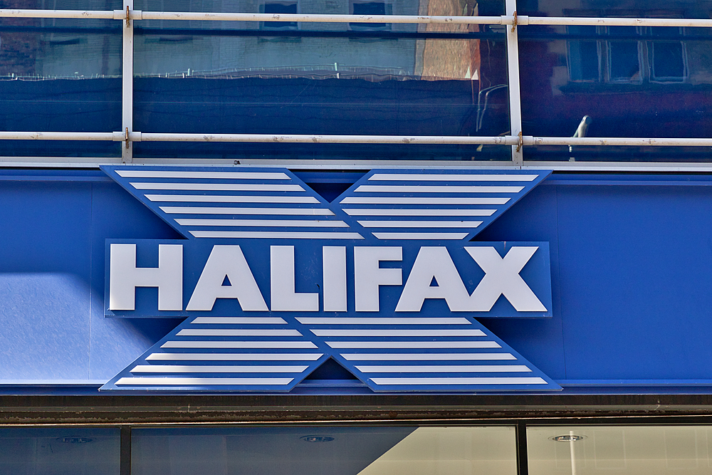 Image displays the Halifax bank logo, featuring an 'X' with white stripes, set against a blue background, and the word 'HALIFAX' in white letters in Liverpool, UK.