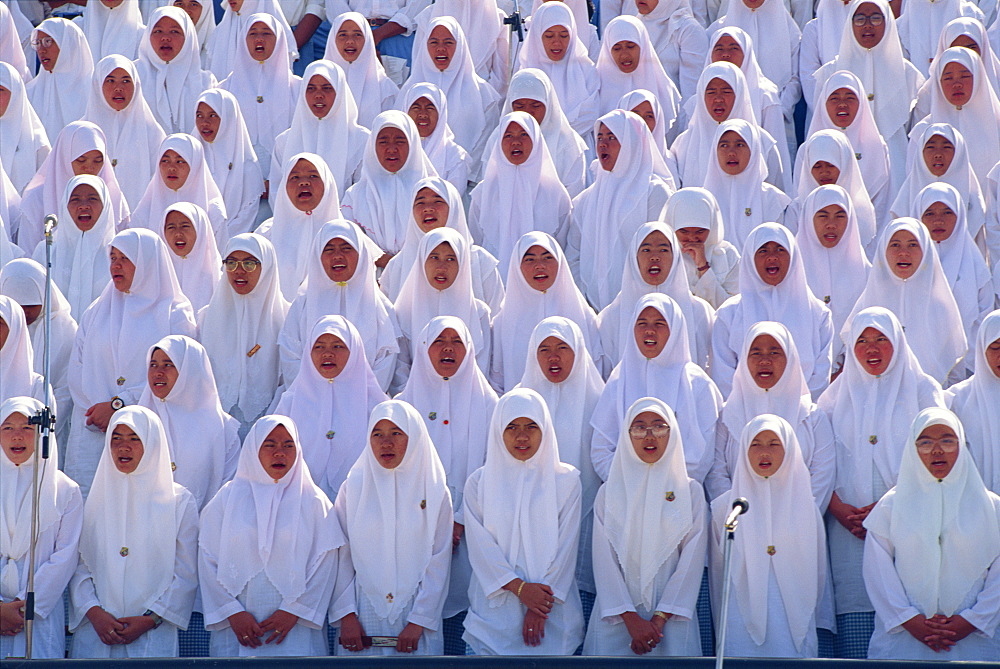 Women in white during the National Day celebrations in the Bandar Seri Begawan stadium in Brunei, Borneo, Southeast Asia, Asia