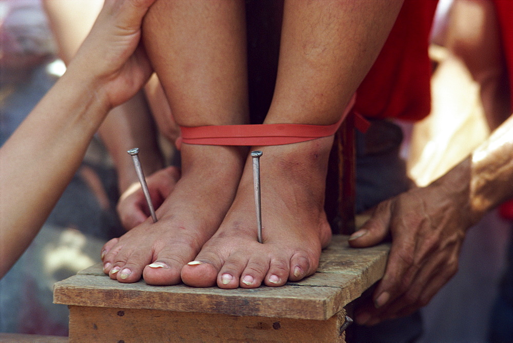 Lucy Reves crucifixion during Holy Week at Easter in Capitanan village in Bulacan Provice, Philippines, Southeast Asia, Asia