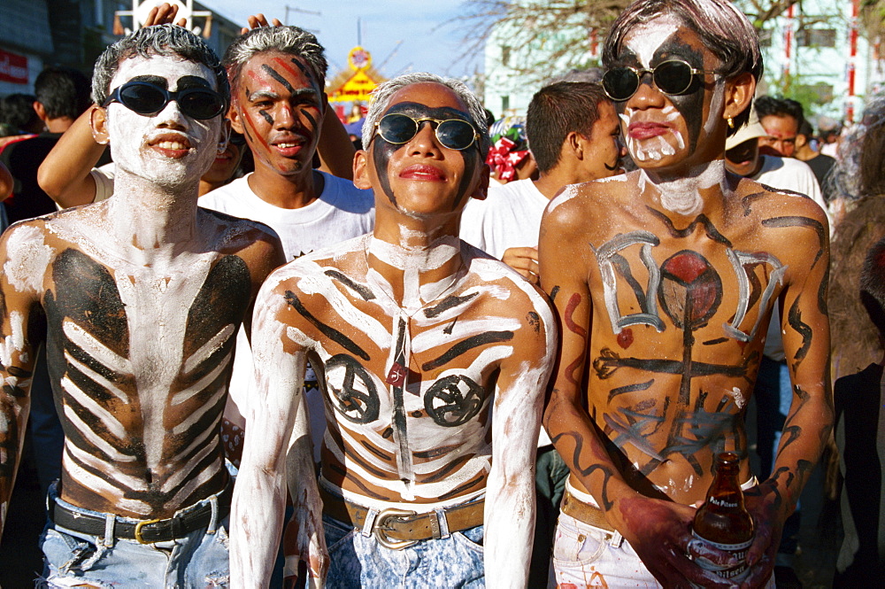 A group of men with body decoration and sunglasses during the Mardi Gras, Ati Atihan, at Kalico on Panay Island, Philippines, Southeast Asia, Asia