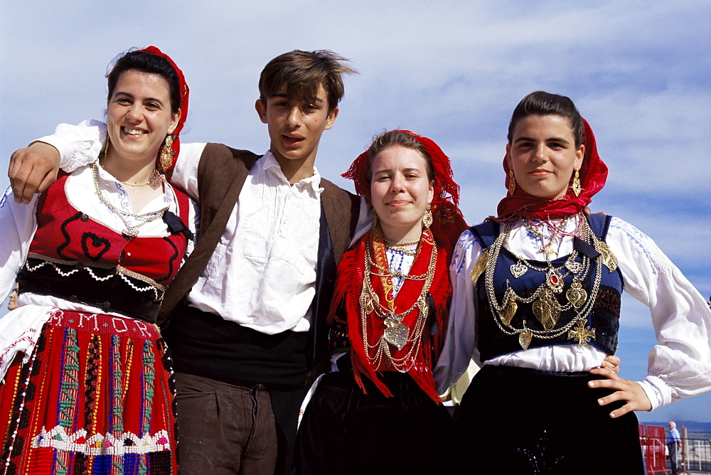 Four people in traditional costume, Festa de Santo Antonio (Lisbon Festival), Lisbon, Portugal, Europe