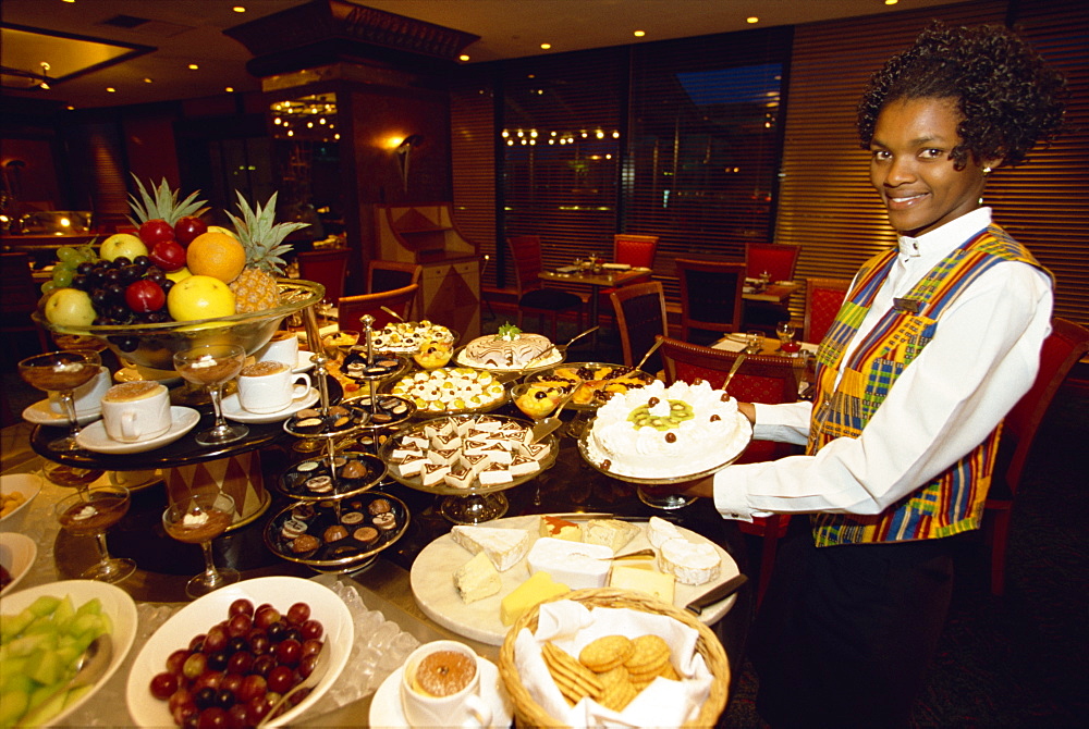 Showing off the evening's spread in Durban, South Africa, Africa