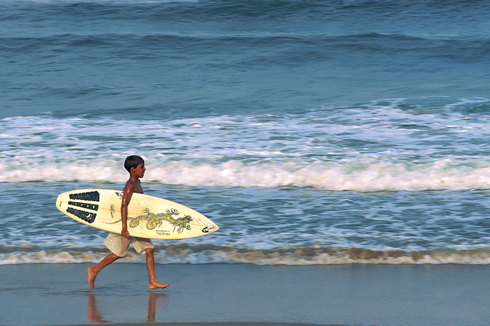 Boy surfing at North Beach, Indian Ocean, Durban, KwaZulu-Natal, South Africa, Africa