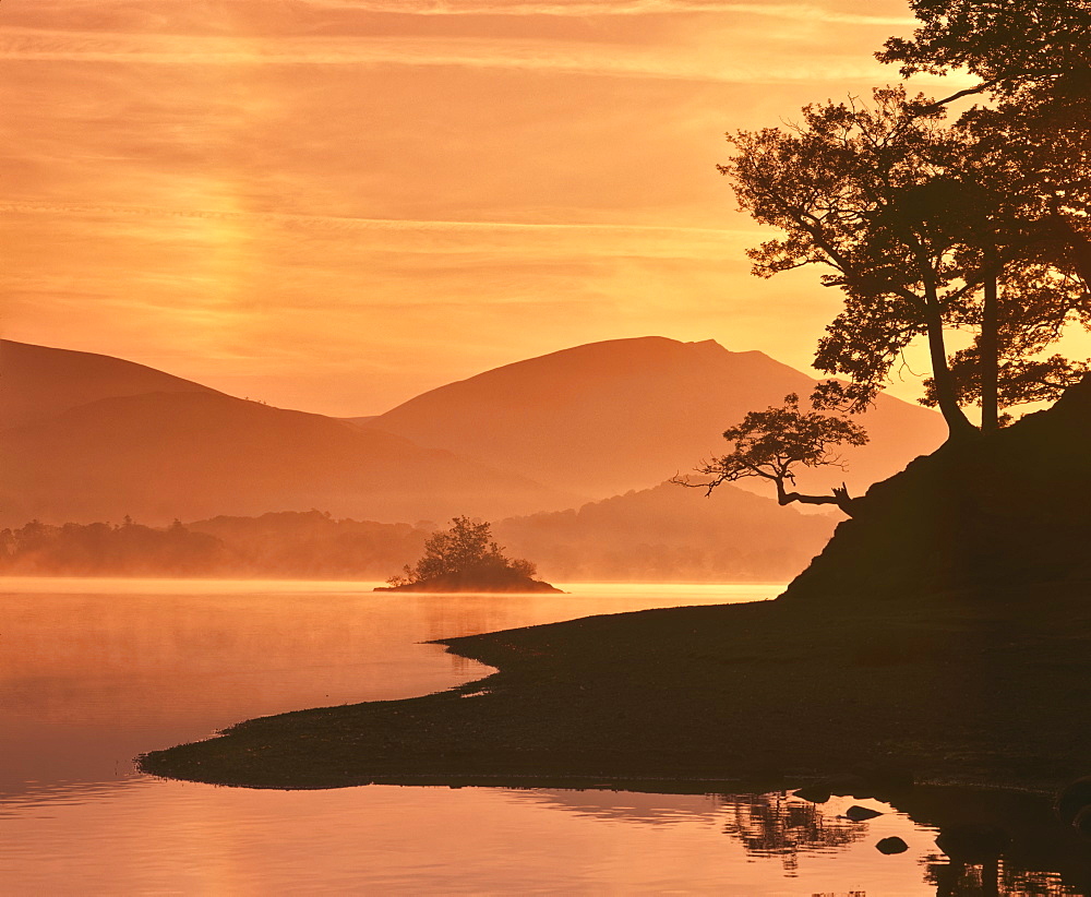 Mist rising on Derwent Water at dawn, Lake District National Park, Cumbria, England, United Kingdom, Europe