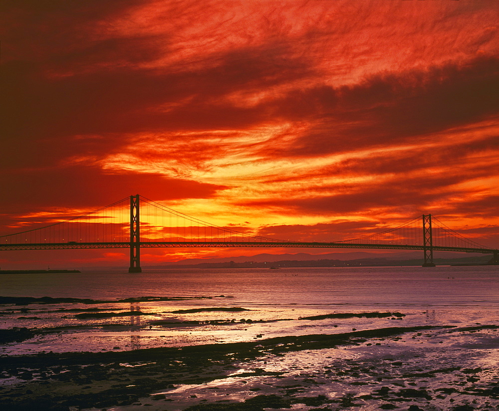 Forth Road Bridge at sunset, crossing the Firth of Forth between Queensferry and Inverkeithing near Edinburgh, Lothian, Scotland, United Kingdom, Europe