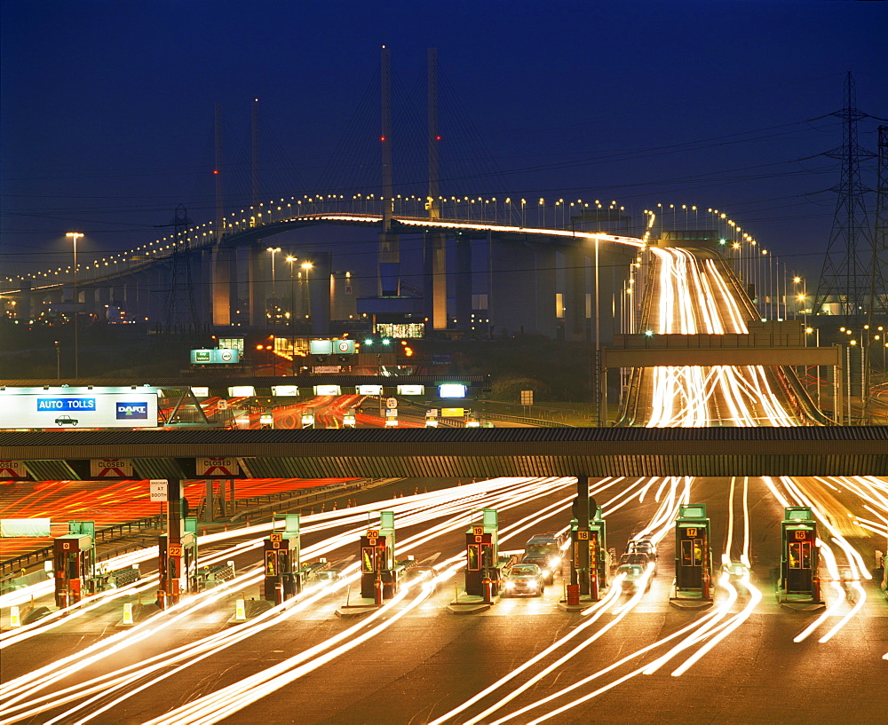 Toll booths on the south side of the Queen Elizabeth II Bridge, crossing the River Thames at Dartford at dusk, border of Kent and Essex, England, United Kingdom, Europe