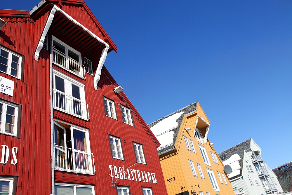 Converted warehouses along harbour front, Tromso, Troms, Norway, Scandinavia, Europe