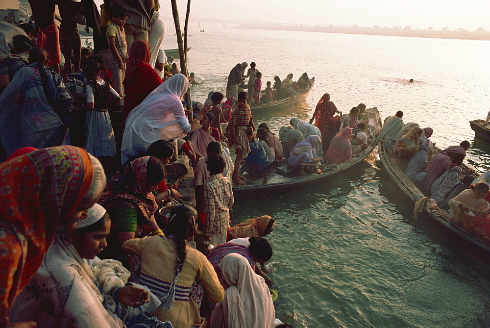 Women take to boats on the River Ganges during Surya Puja (Sun Worship Festival), Varanasi, Uttar Pradesh state, India, Asia