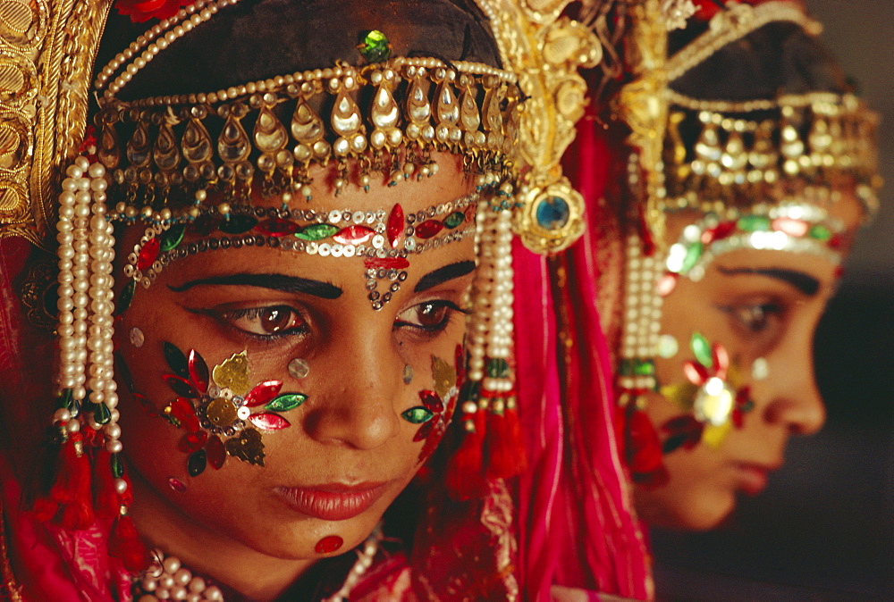 Portrait of a young actor in jewels and make-up from the Ramlilla, the stage play of the great Hindu Epic, the Ramayana, Varanasi (Benares), Uttar Pradesh State, India