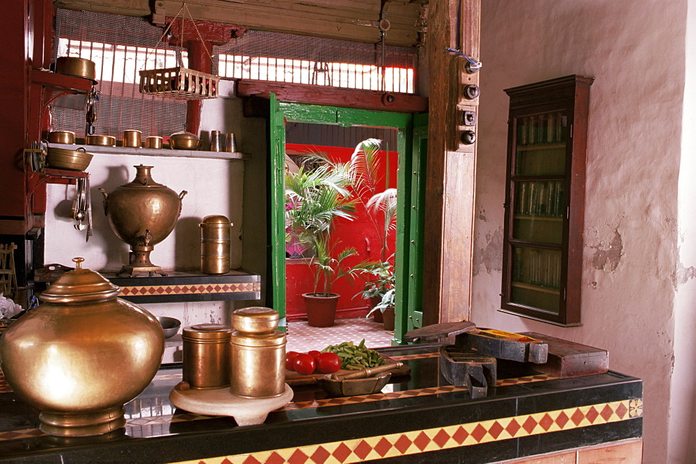 Kitchen area with traditional brass cooking utensils and samovar in restored traditional Pol house, Ahmedabad, Gujarat state, India, Asia