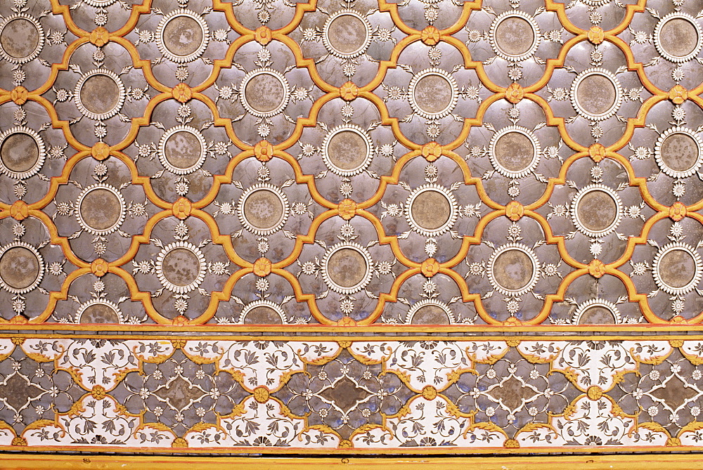 Detail of the fine mirror and plaster work found in the Sheesh Mahal (mirrored hall), The City Palace, Jaipur, Rajasthan state, India, Asia