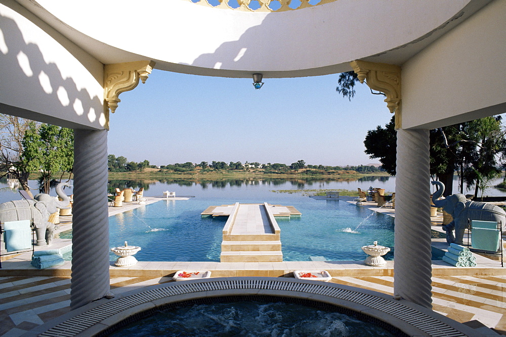 The swimming pool overlooking the lake at Dungarpur, Udai Bilas Palace, Dungarpur, Rajasthan state, India, Asia 