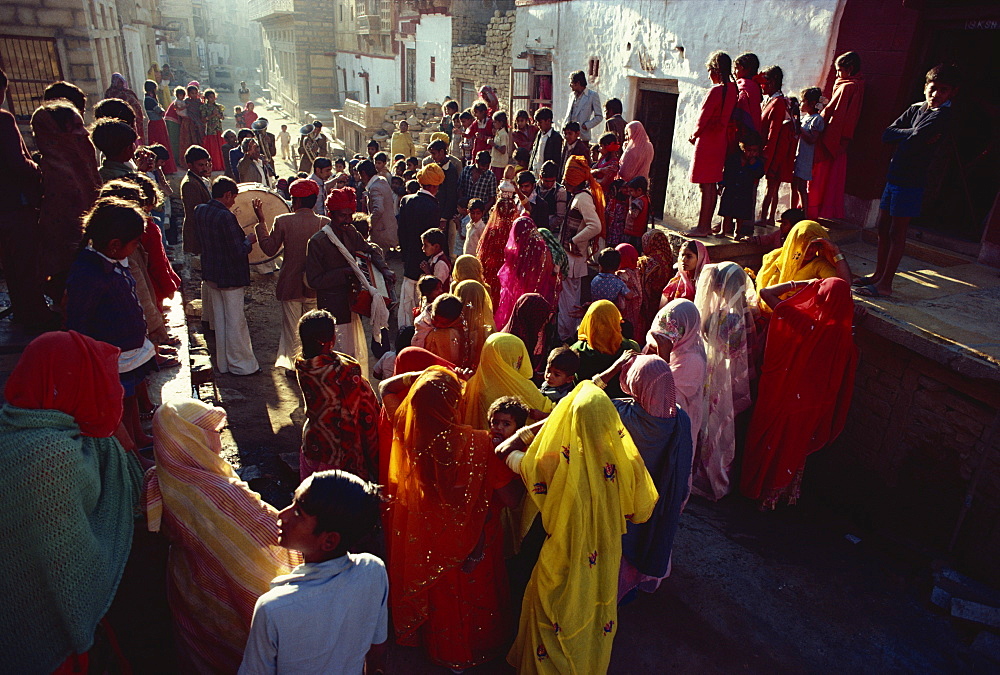 Family and friends gather to accompany a bride and bridgroom to their wedding, Jaisalmer, Rajasthan state, India, Asia