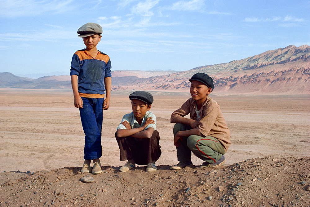 Portrait of three boys, Turpan, Xinjiang, China, Asia