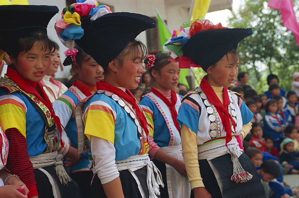 Cock Miao girls singing at performance, Guizhou, China, Asia