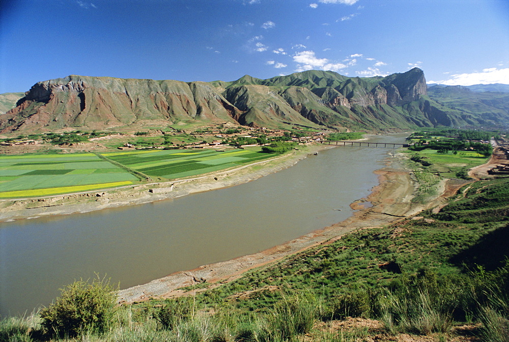 Rape and barley fields by the Hwang Ho, Yellow River, at Lajia, Qinghai Province, China